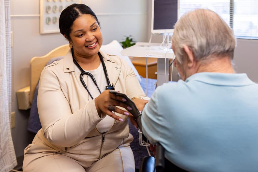 Nurse taking patient's blood pressure at Johns Island Post Acute